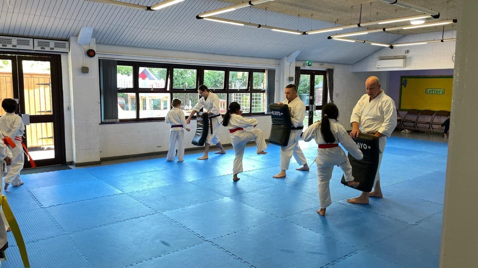 Practicing kicks in the children's karate class